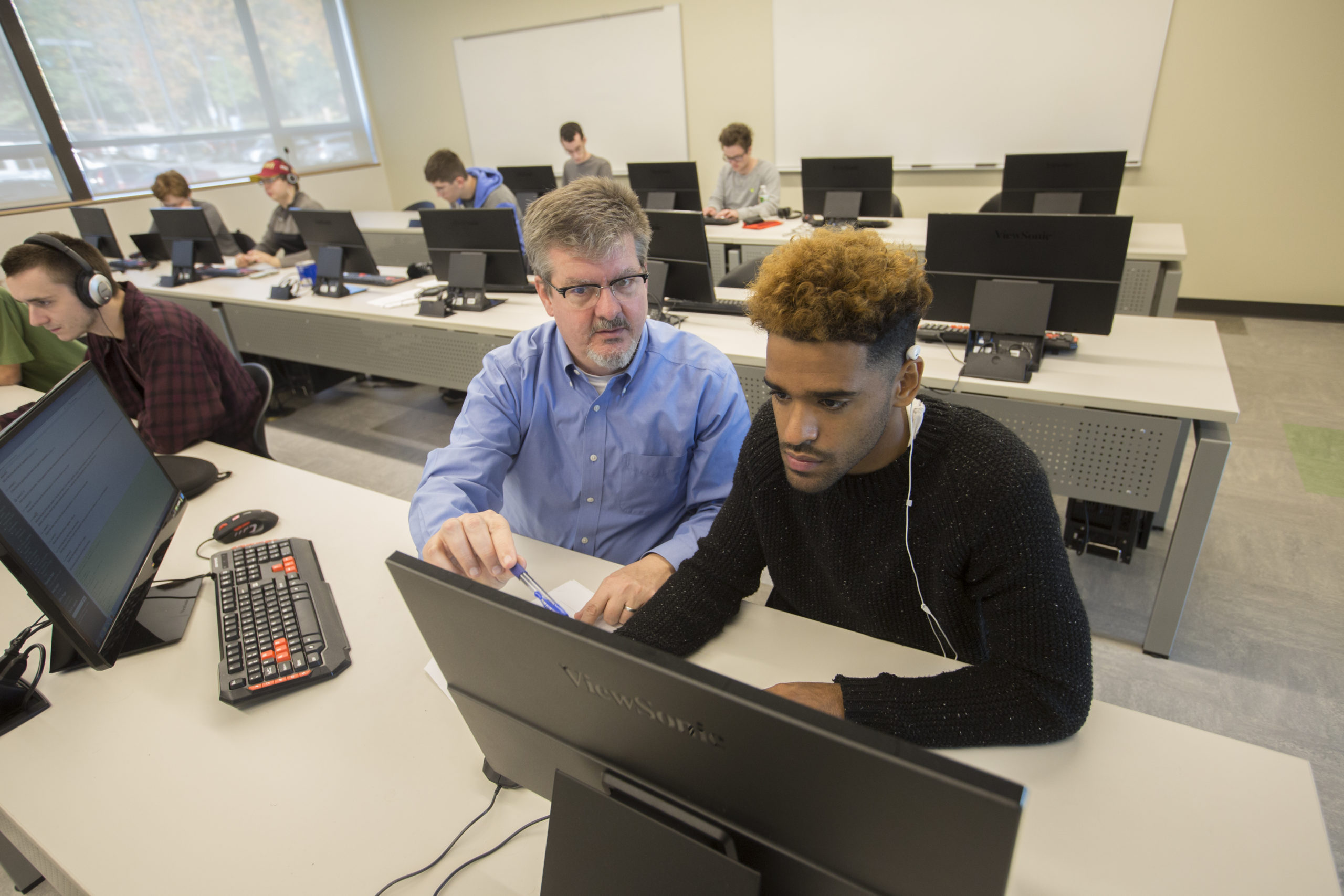 Landmark College Student on Computer with Instructor